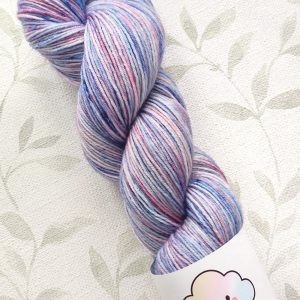 hand dyed 4 ply 100g in shades of lilac, pink and blue with pink, blue speckles. called Hyacinth Speckle.