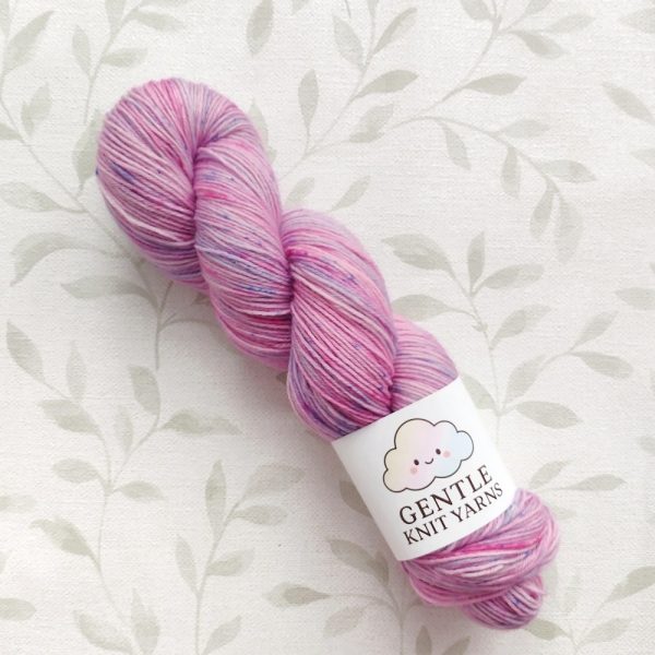 hand dyed yarn 4 ply 100g shades of pink and lilac with pink and blue speckles called Fairy Speckle.