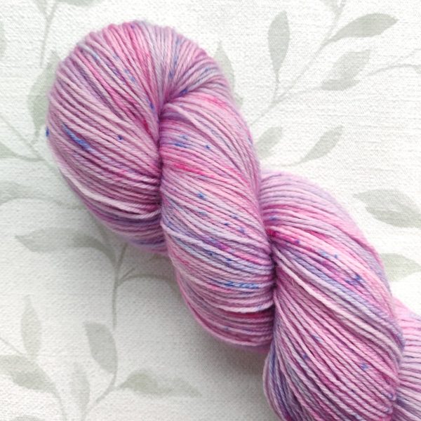 hand dyed 4 ply yarn 100g pink and lilac with blue speckles called Fairy Speckle