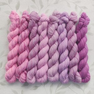 hand dyed 4 ply merino nylon mini skein set 8 x 20g pinks and purples called Lilac Blossom
