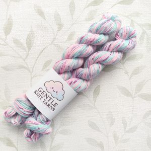 Hand dyed 4 Ply 2 x 20g Mini skeins in shades of pink and aqua with pink, blue and plum speckles called Aqua Pink Speckle.