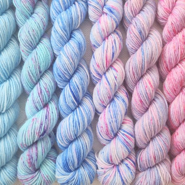 hand dyed 4 ply set of 6 x 20g mini skeins in shades of blue and pink with speckles called Blue Pink Speckle.