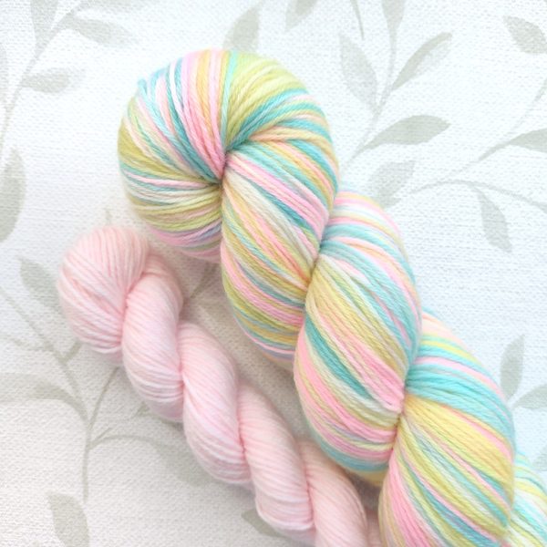 hand dyed 4 ply sock set of 100g plus 20g mini in pastel rainbow shades with pastel pink mini called Pastel Rainbow.