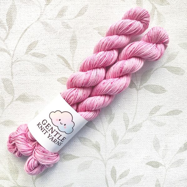 hand dyed 4 ply 2 x 20g mini skeins in shades of soft pink with pink and plum speckles called Pink Roses.