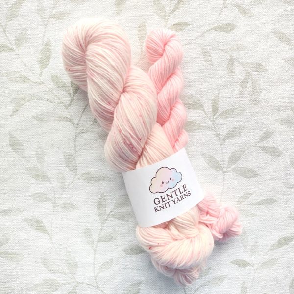 hand dyed 4 ply sock yarn set includes 100g pink and white with pink speckles. 20g mini skein in soft pastel pink. Sock Set called Pink White Blossoms.