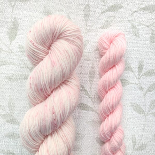 hand dyed 4 ply sock yarn set includes 100g pink and white with pink speckles. 20g mini skein in soft pastel pink. Sock Set called Pink White Blossoms.