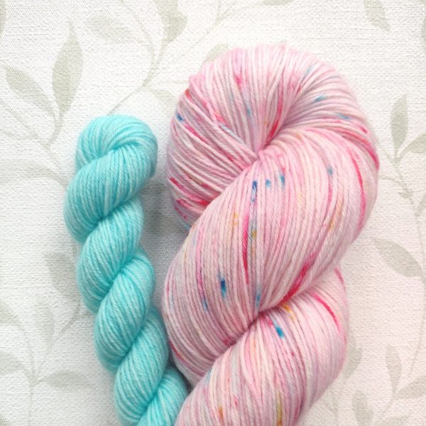 hand dyed 4 ply sock set. 100g in shades of pink with rainbow speckles. 20g mini in soft aqua shades. Set called Birthday Party.