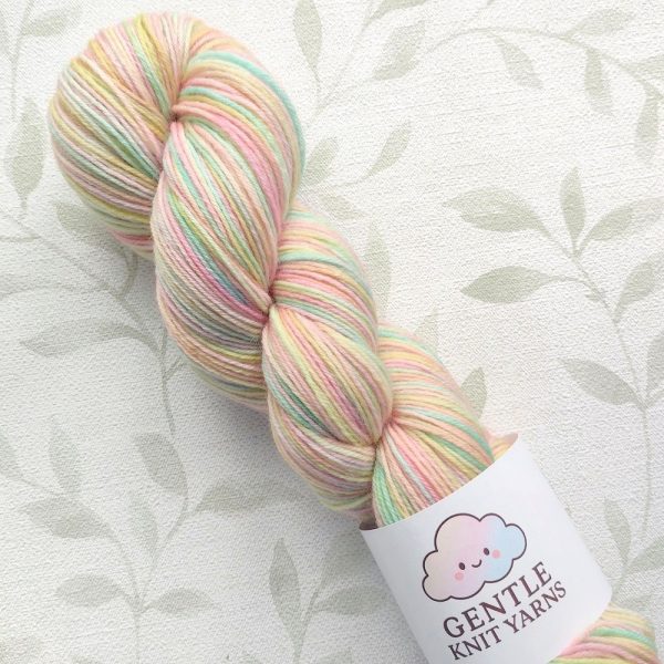 hand dyed 4 ply yarn in subtle pastel rainbow shades called Rainbow Whisper.