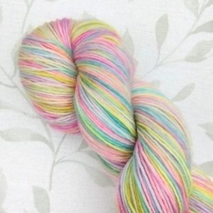 hand dyed 4ply 100g yarn in rainbow pastel shades called Rainbow Dreams.