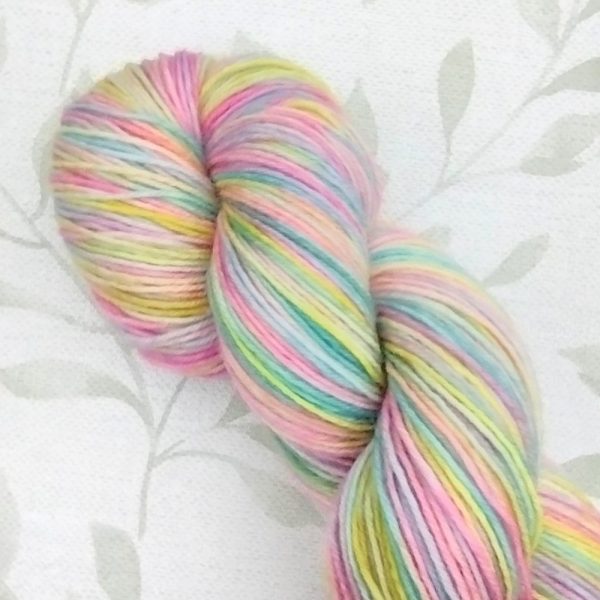 hand dyed 4ply 100g yarn in rainbow pastel shades called Rainbow Dreams.
